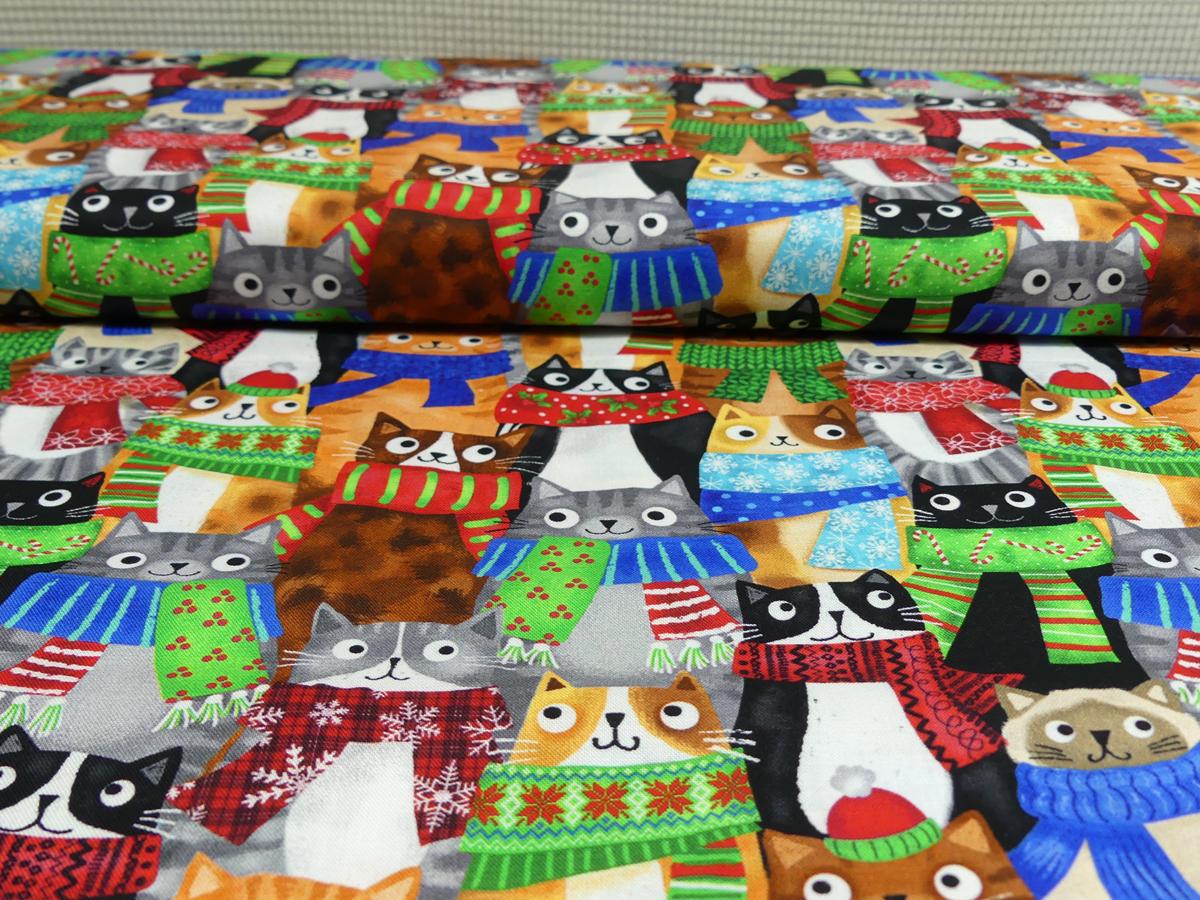 Patchworkstoff mit Katzen, die unterschiedliche bunte Schals tragen